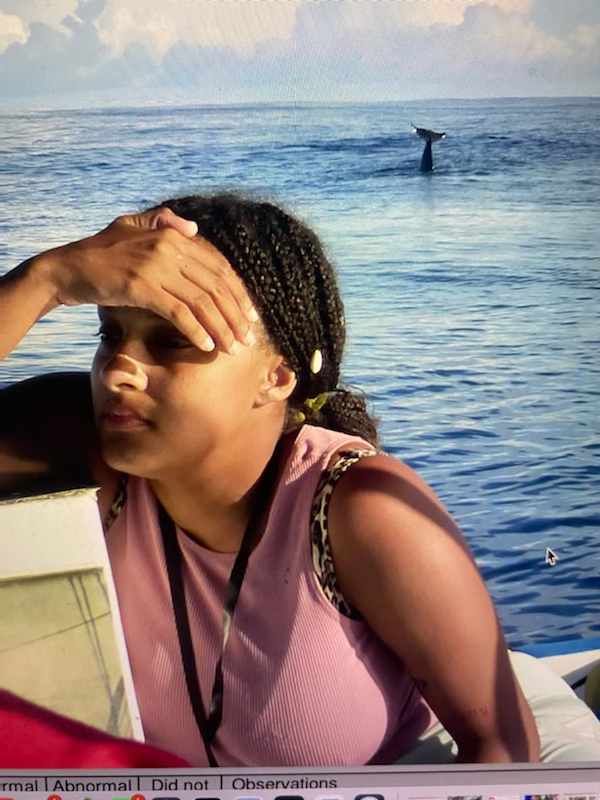 Chelsea Drumgoole, CVM Class of 2023, works on spotting whales during a trip to the Galapagos in March 2022.