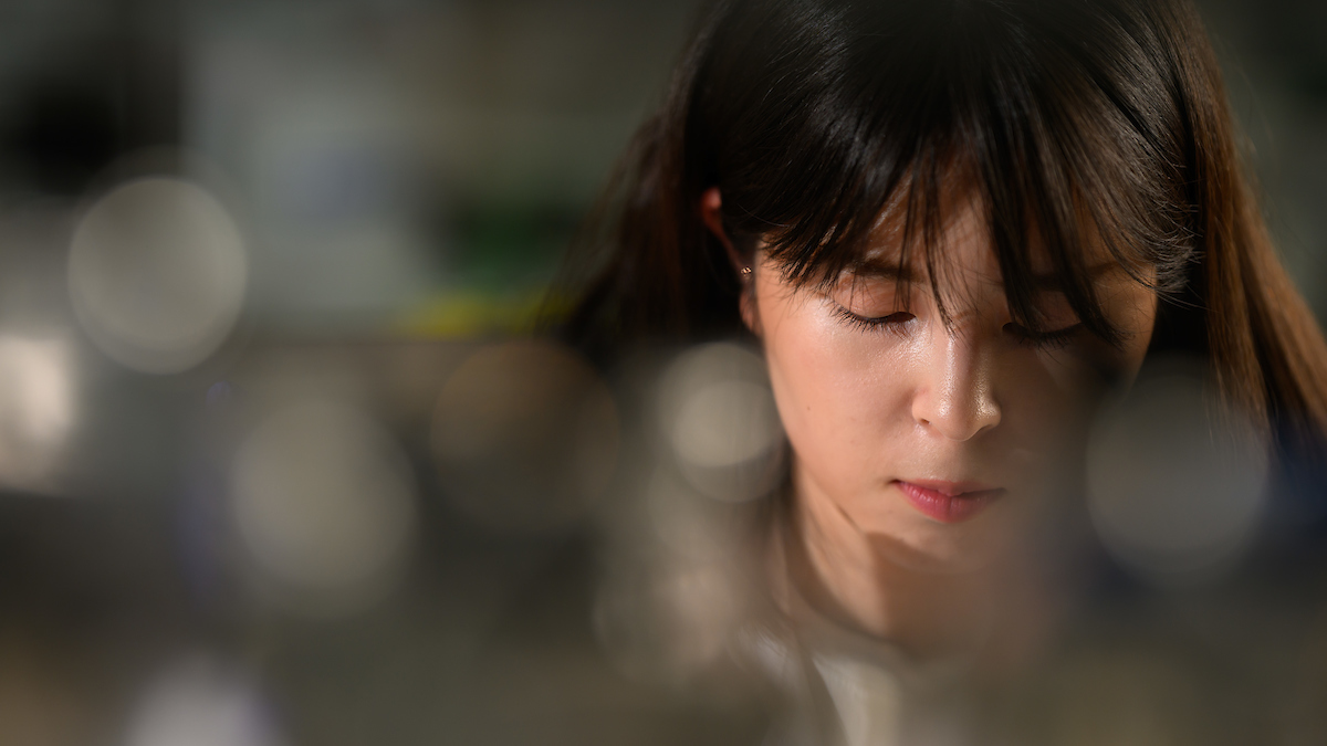 A woman working in a lab.