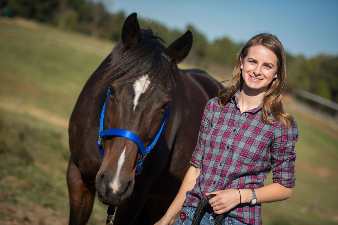 Alix Berglund walks horse