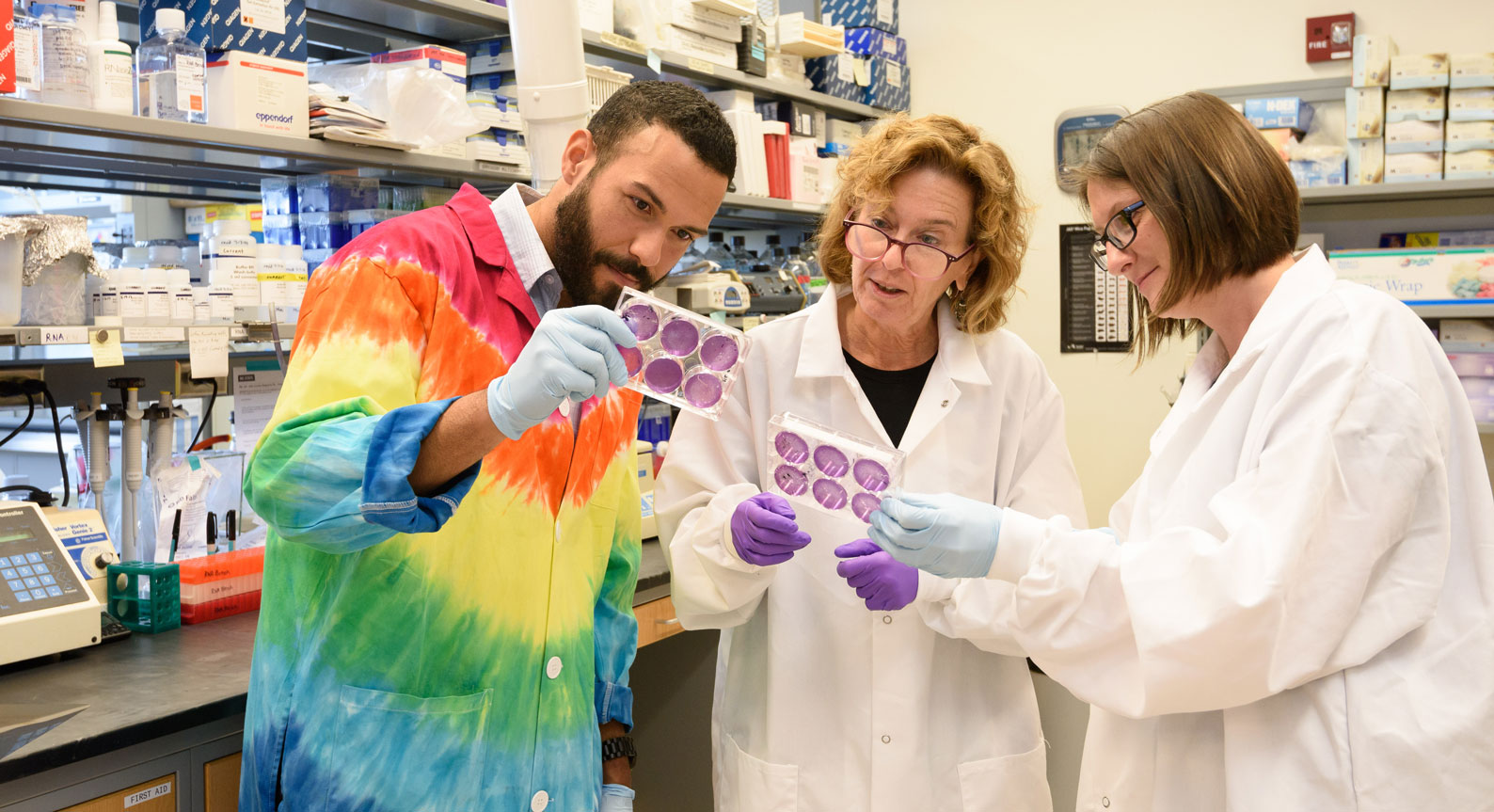 Barb Sherry reviewing samples with team