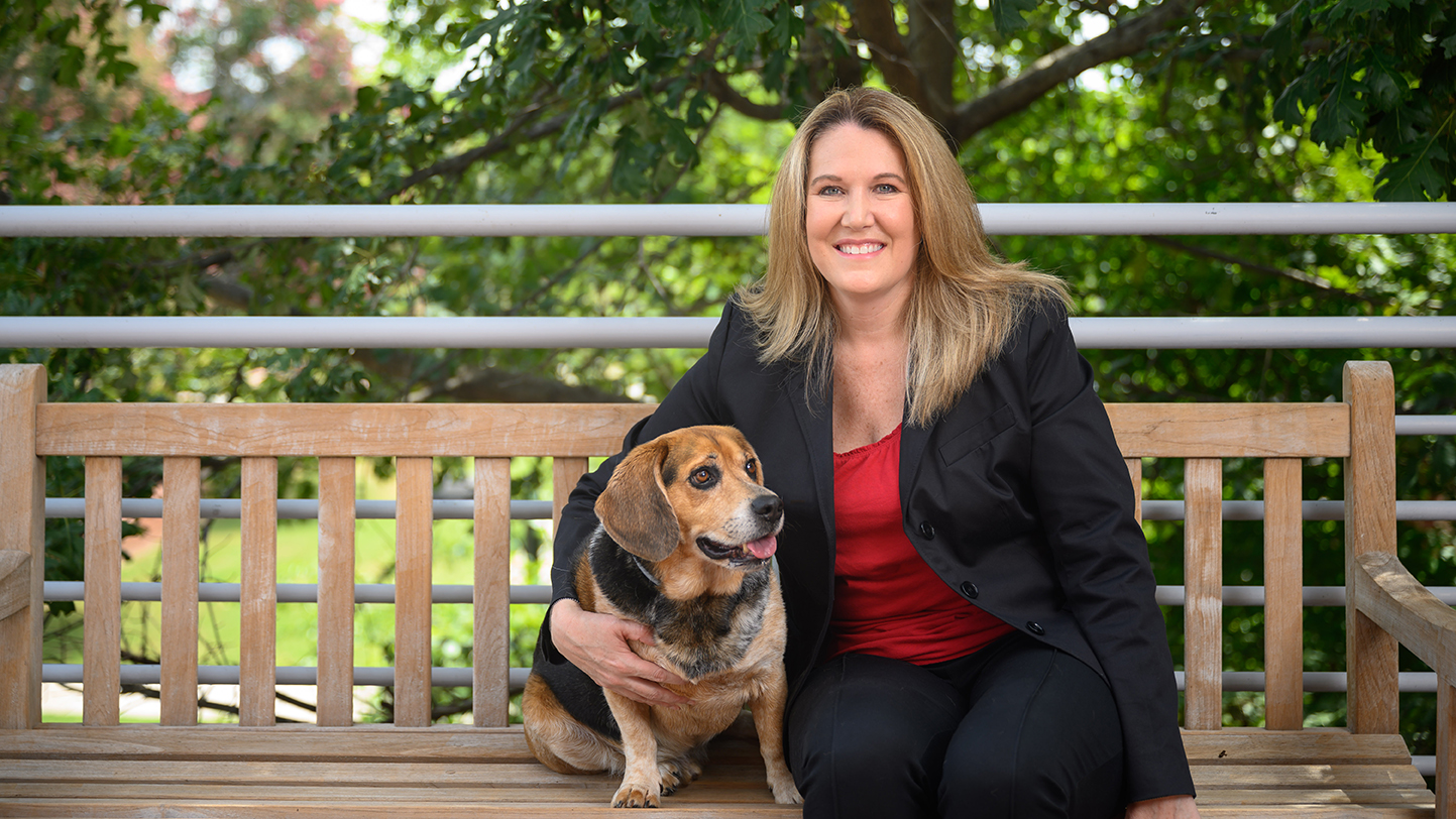 Danielle Pfaff, NC State Veterinary Hospital administrator, with her dog Trigger. Photo by John Joyner/NC State Veterinary Medicine