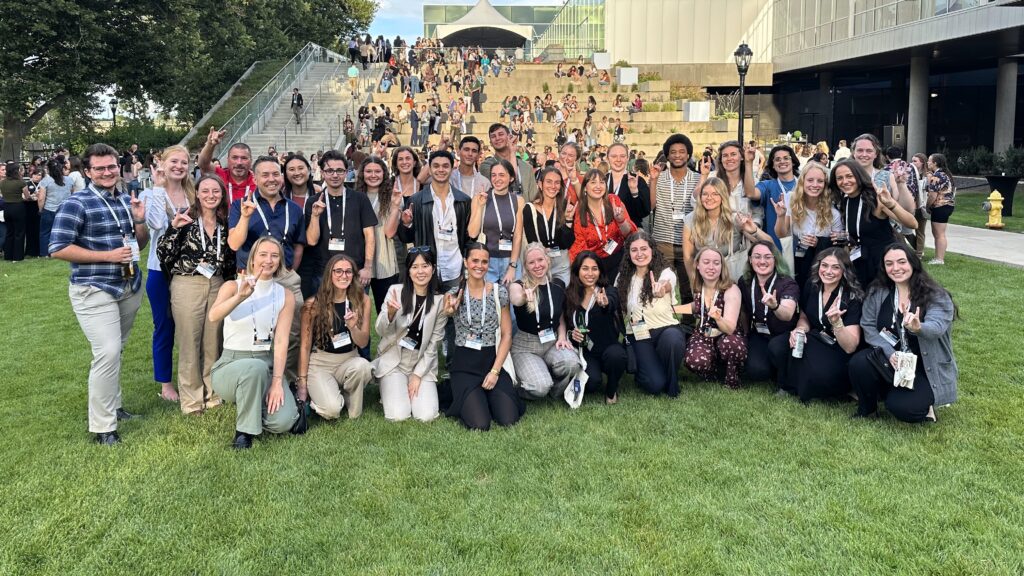 a picture of NC State College of Veterinary Medicine students posing on a grassy area at the 2025 Veterinary Scholars Symposium